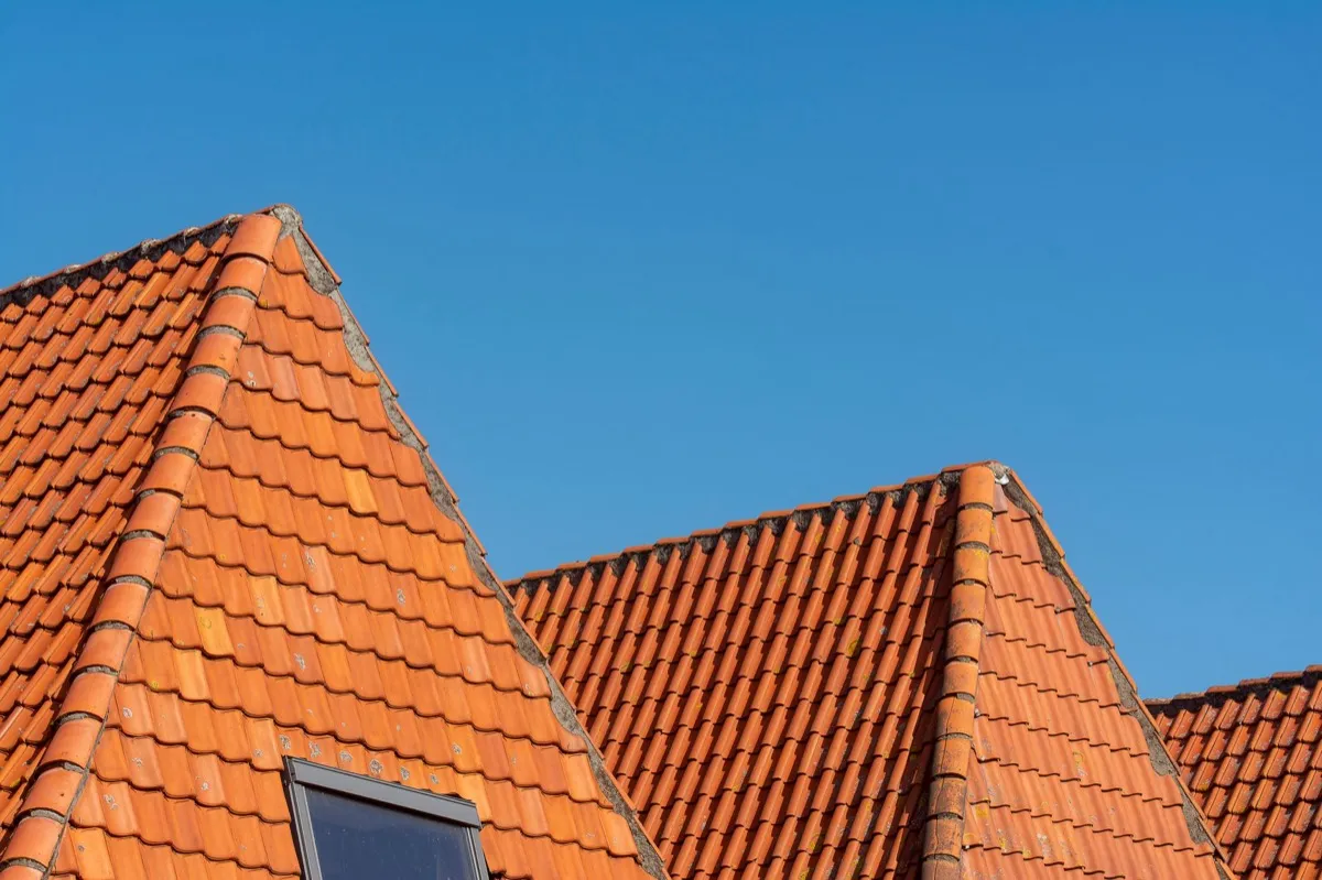 Clay barrel tile rooflines on homes in Minneapolis, MN